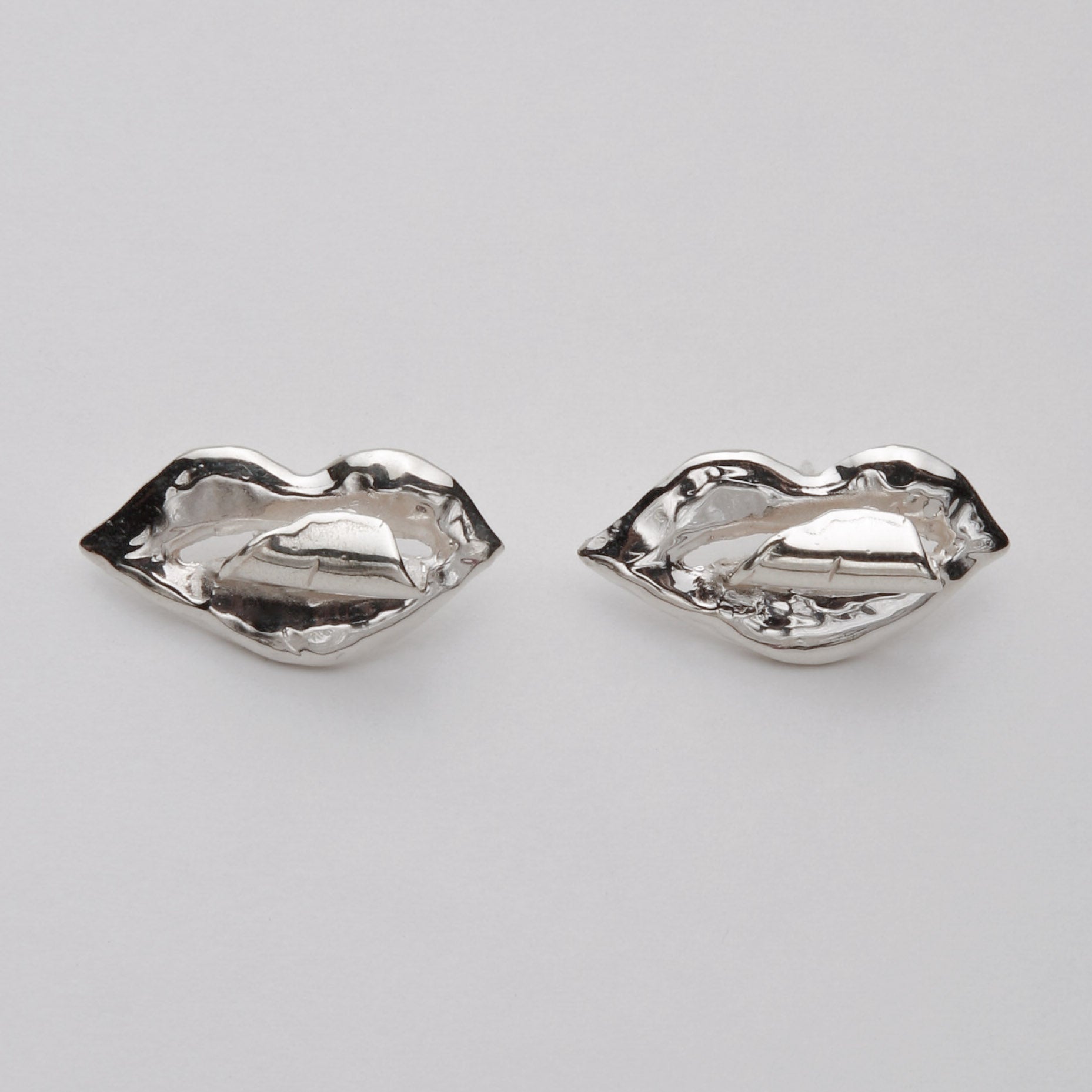 TONGUE EARRINGS